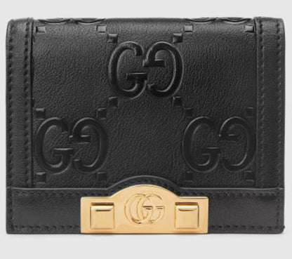SALE★GG Deboss柄【送込GUCCI】2折中財布★黒白革/金デコ-BUYMA