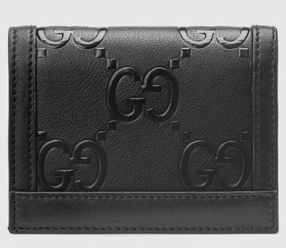 SALE★GG Deboss柄【送込GUCCI】2折中財布★黒白革/金デコ-BUYMA
