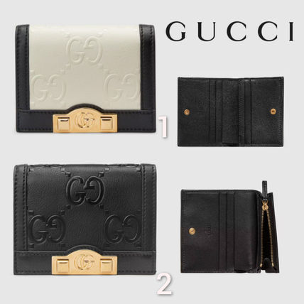 SALE★GG Deboss柄【送込GUCCI】2折中財布★黒白革/金デコ-BUYMA