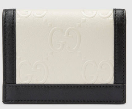 SALE★GG Deboss柄【送込GUCCI】2折中財布★黒白革/金デコ-BUYMA